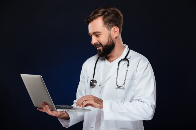 Doctor working on a laptop